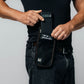 Phone faraday bag Leblok Security attached to belt - a man placing phone inside the bag